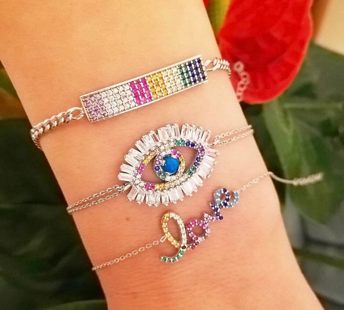 evil eye bracelets in sterling silver colors gold, rose gold and silver. Evil eye rainbow bracelet. Khamsa bracelets.