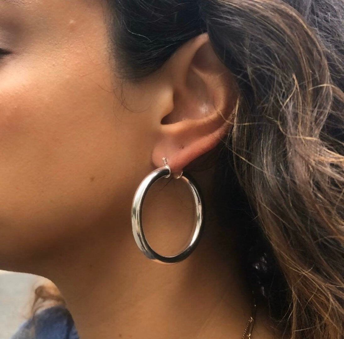 18K Gold-filled hollow hoop earrings in gold and silver. 2” diameter. Super light weight and hollow. Gold filled hoops. Gold filled earrings