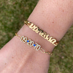 Custom name bracelet on a cuban link chain. Personalized script name bracelet. Sterling silver gold plated nameplate bracelet.