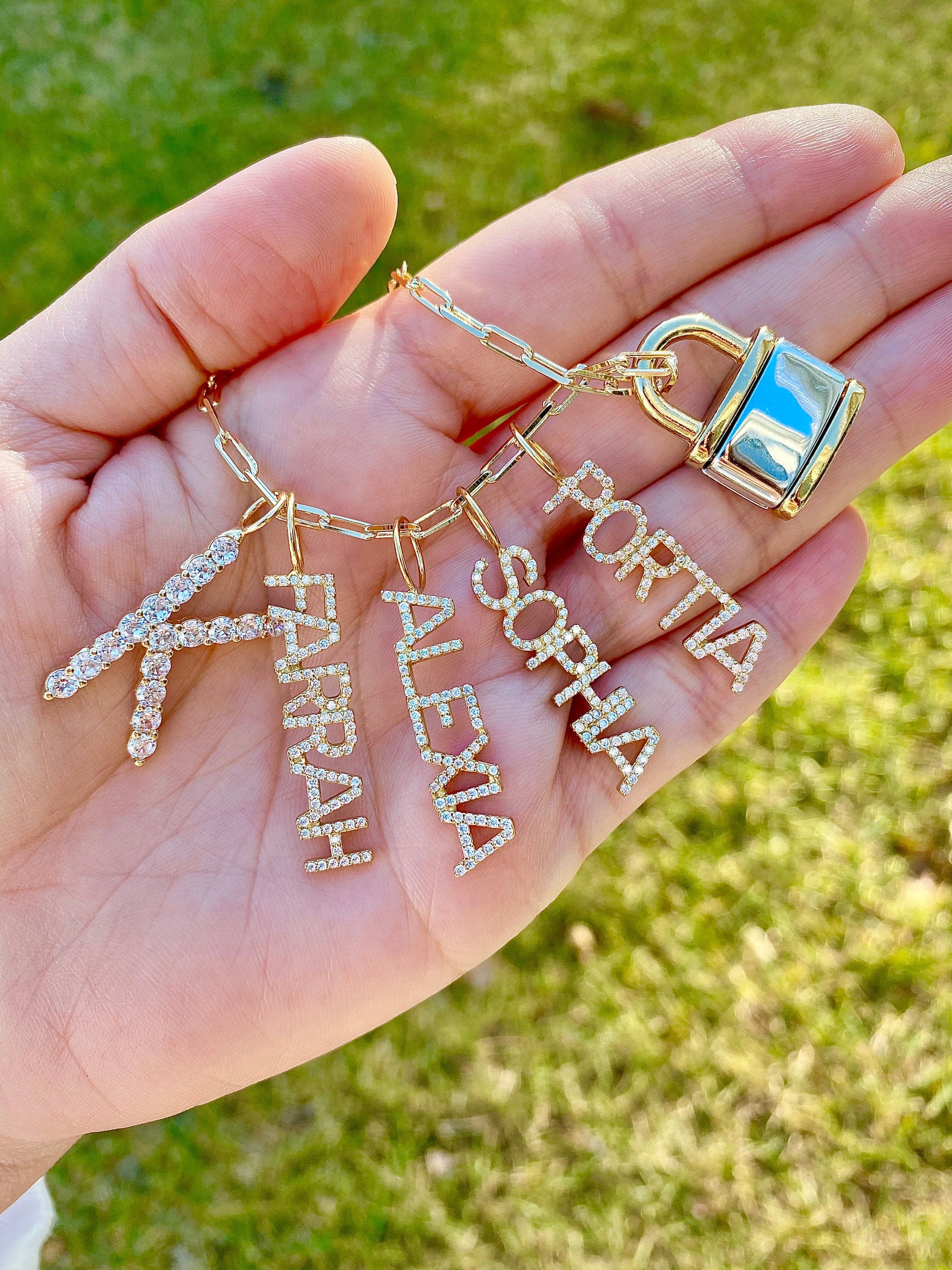 As seen on Kyle Richards, Kathy Hilton and Teddi Mellencamp. Personalized Pave Name Charms. Diamond Charms. CZ charms. Custom name charms.