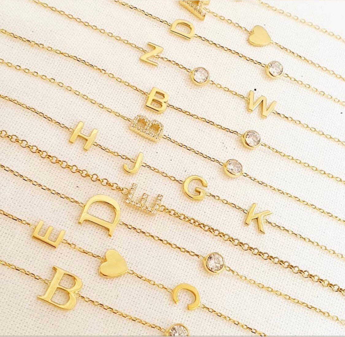 Sterling silver and gold plated CZ initial bracelets. Letter bracelets. Personalized bracelets. Mommy bracelet with heart.