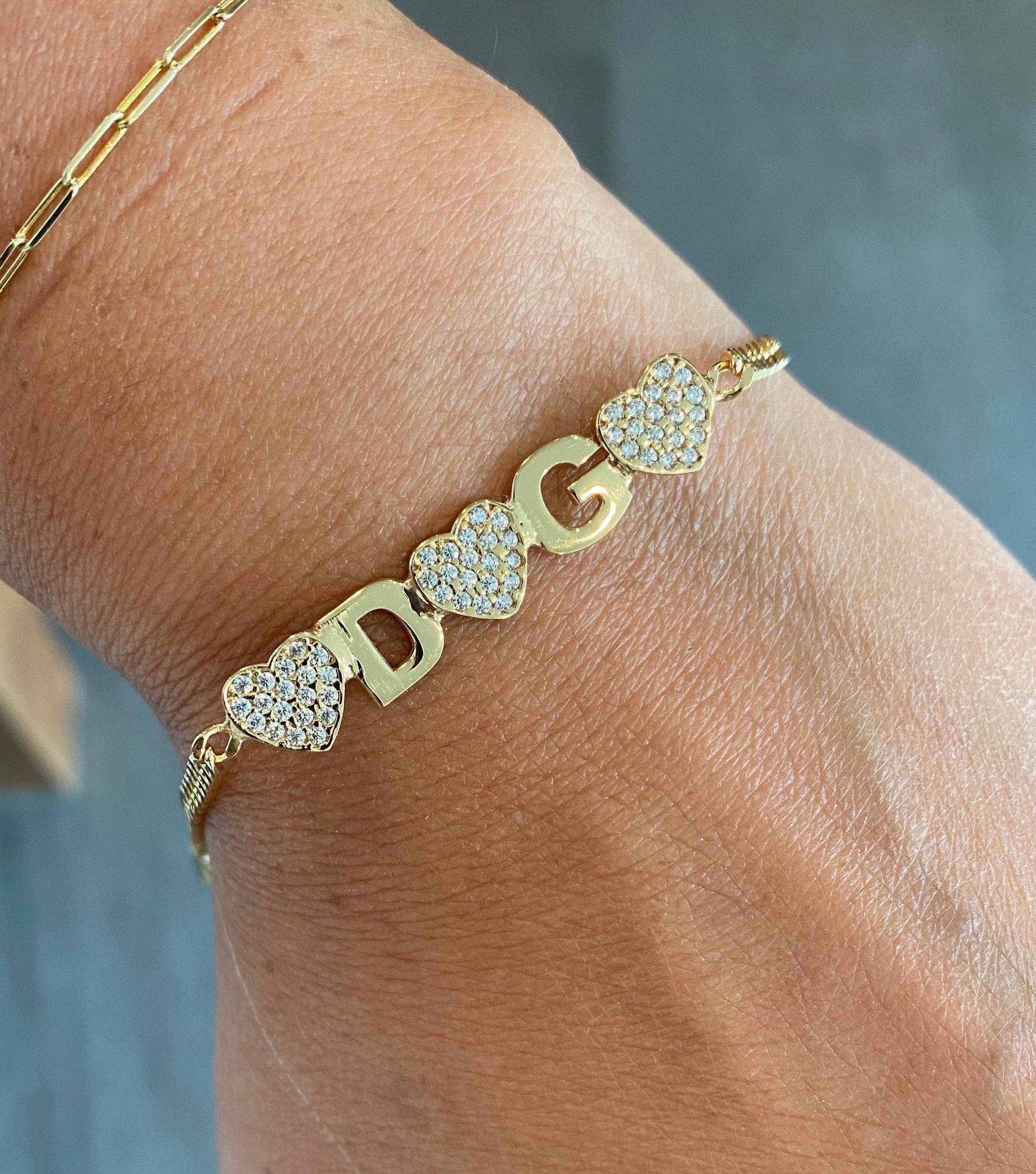 Custom Ashley name bracelet on cuban link chain. Personalized name bracelet on curb link chain. Personalized nameplate bracelet with hearts