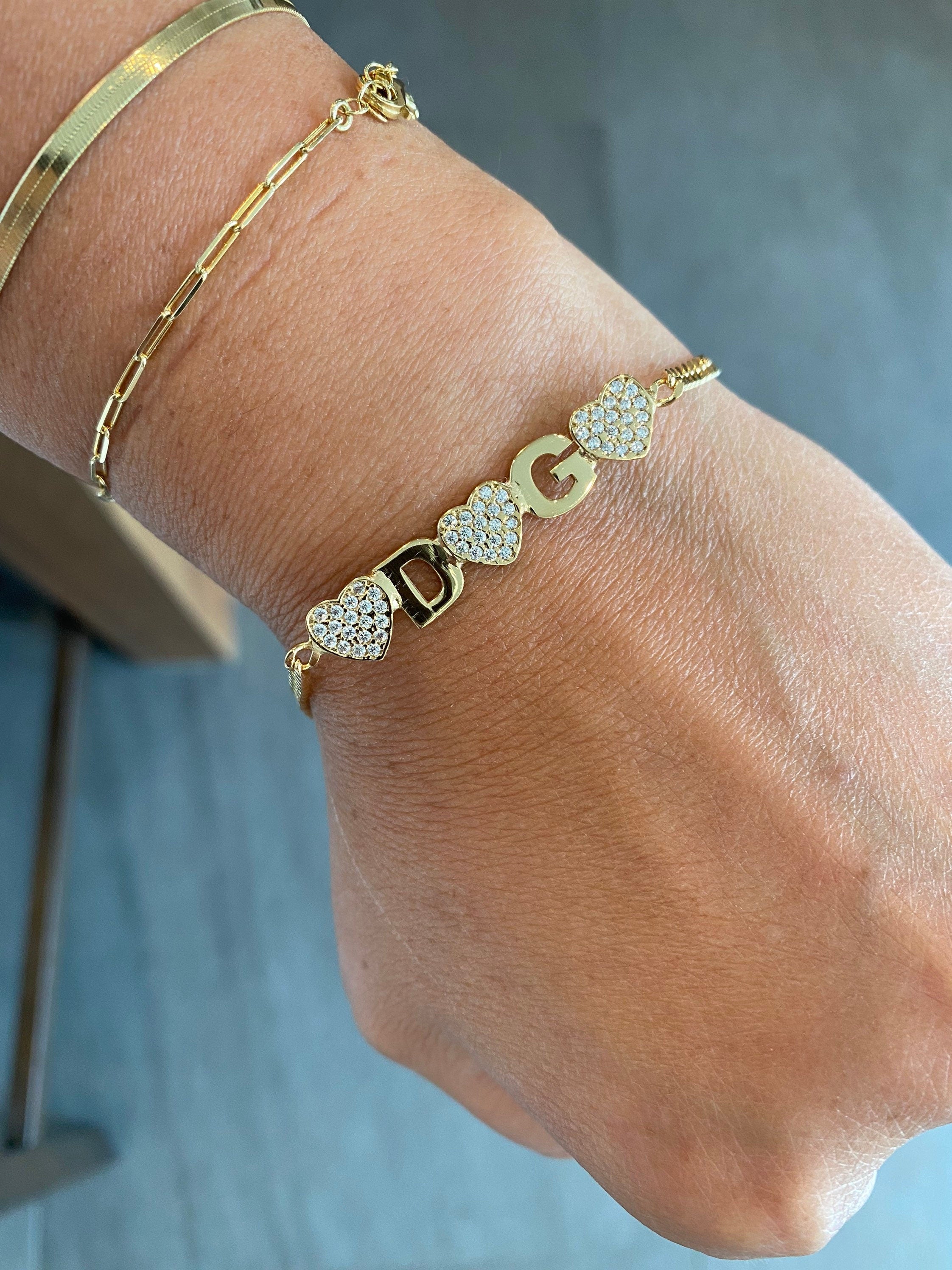 Custom Ashley name bracelet on cuban link chain. Personalized name bracelet on curb link chain. Personalized nameplate bracelet with hearts