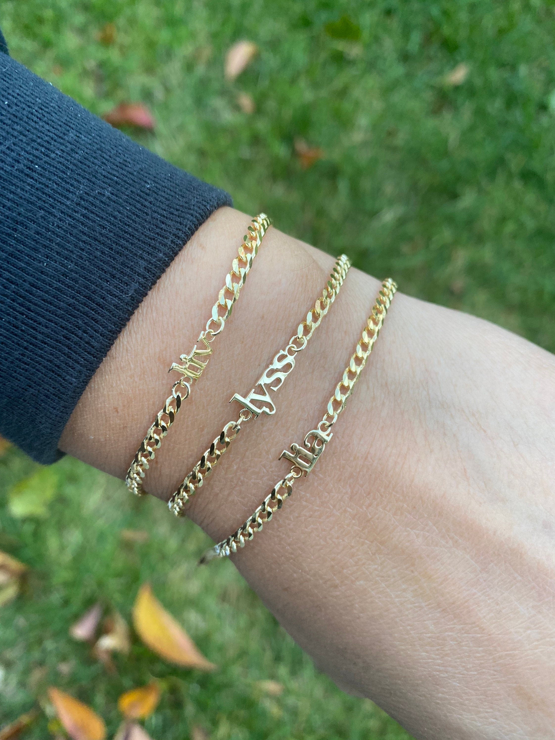 Custom name bracelet on a cuban link chain. Personalized name bracelet on a curb chain. Sterling silver gold plated nameplate bracelet.