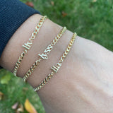 Custom name bracelet on a cuban link chain. Personalized name bracelet on a curb chain. Sterling silver gold plated nameplate bracelet.