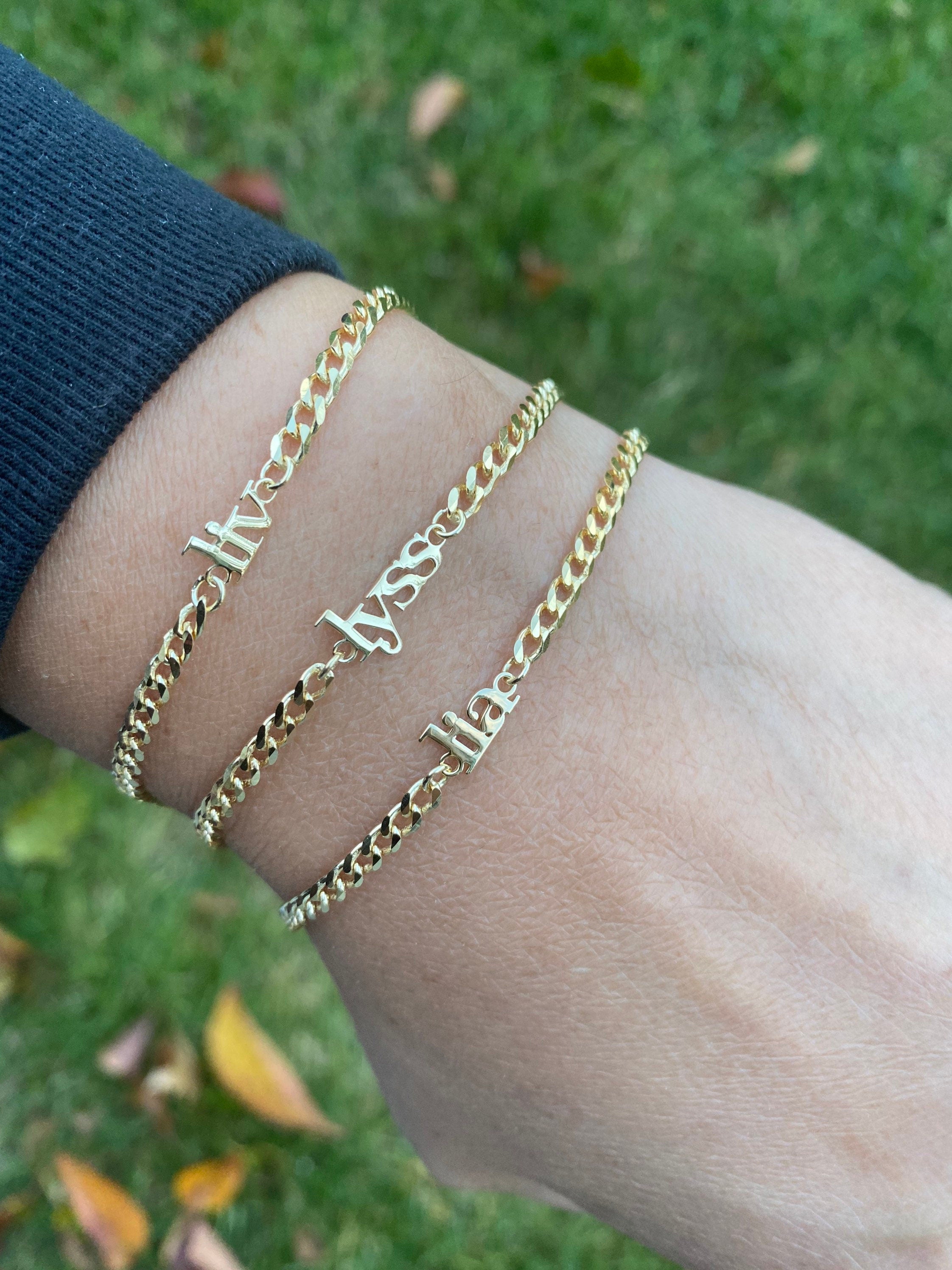 Custom name bracelet on a cuban link chain. Personalized name bracelet on a curb chain. Sterling silver gold plated nameplate bracelet.