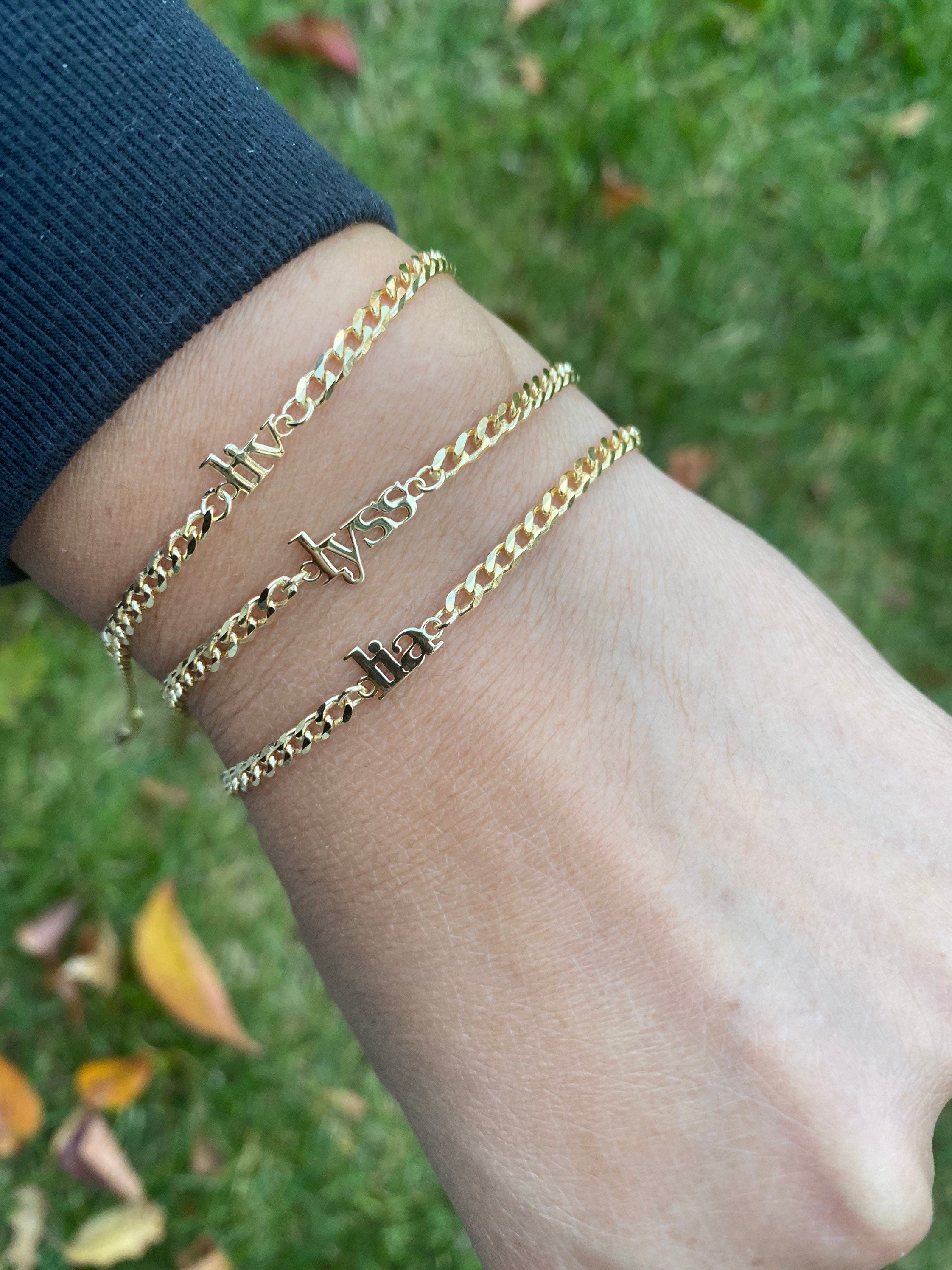 Custom name bracelet on a cuban link chain. Personalized name bracelet on a curb chain. Sterling silver gold plated nameplate bracelet.