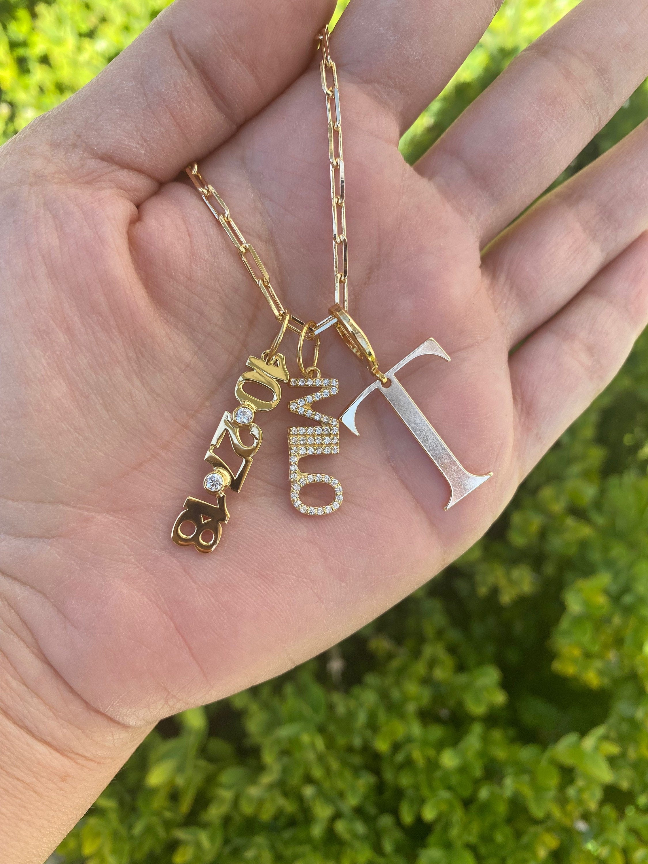 As seen on Tara Moni. Personalized Pave Name Charms. Diamond Charms. Custom name charms. Jumbo Initial charm. Date charm. Anniversary charm