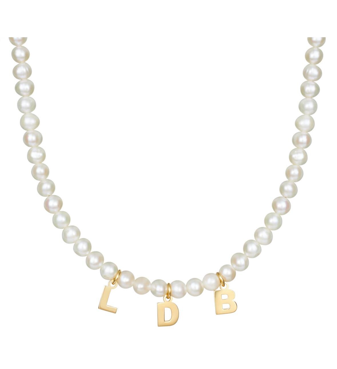 Mommy necklace with pearls and initials. Sterling silver and 14K gold plated. Available in gold or silver.