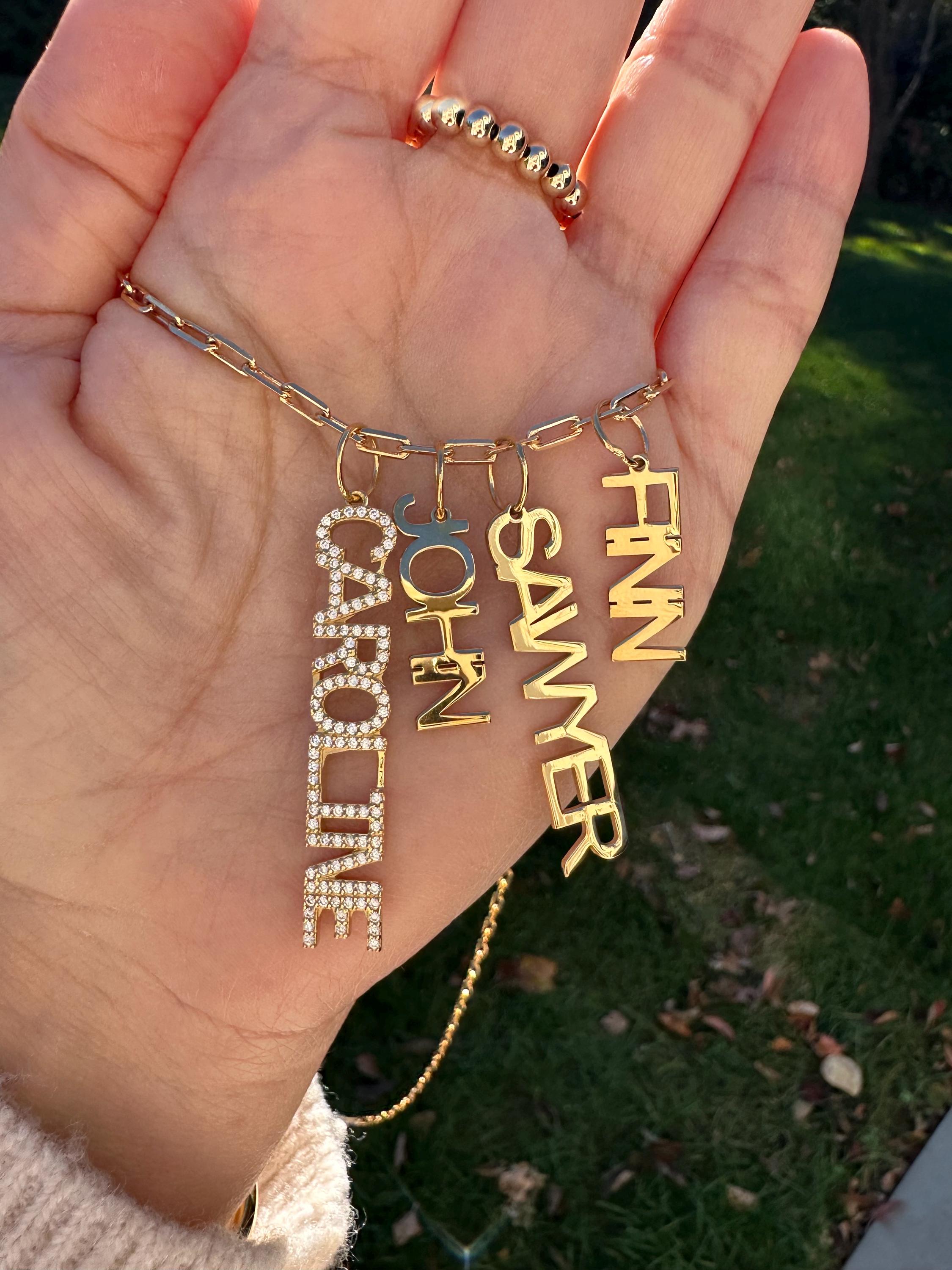 As seen on Caroline Baudino. Personalized Pave Name Charms. Diamond Charms. CZ charms. Custom name charms on Shop with Caroline.