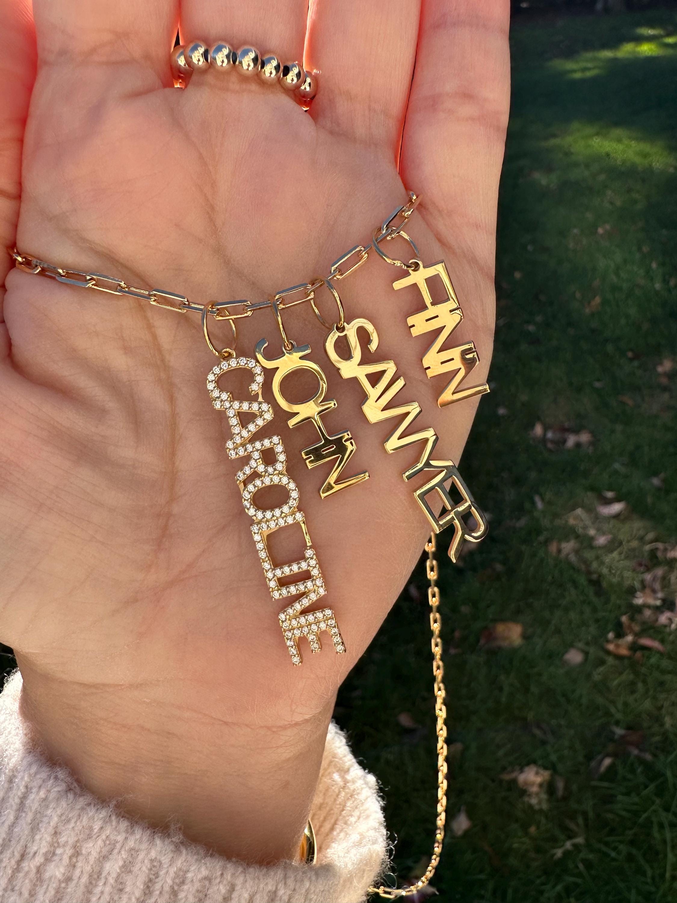 As seen on Caroline Baudino. Personalized Pave Name Charms. Diamond Charms. CZ charms. Custom name charms on Shop with Caroline.