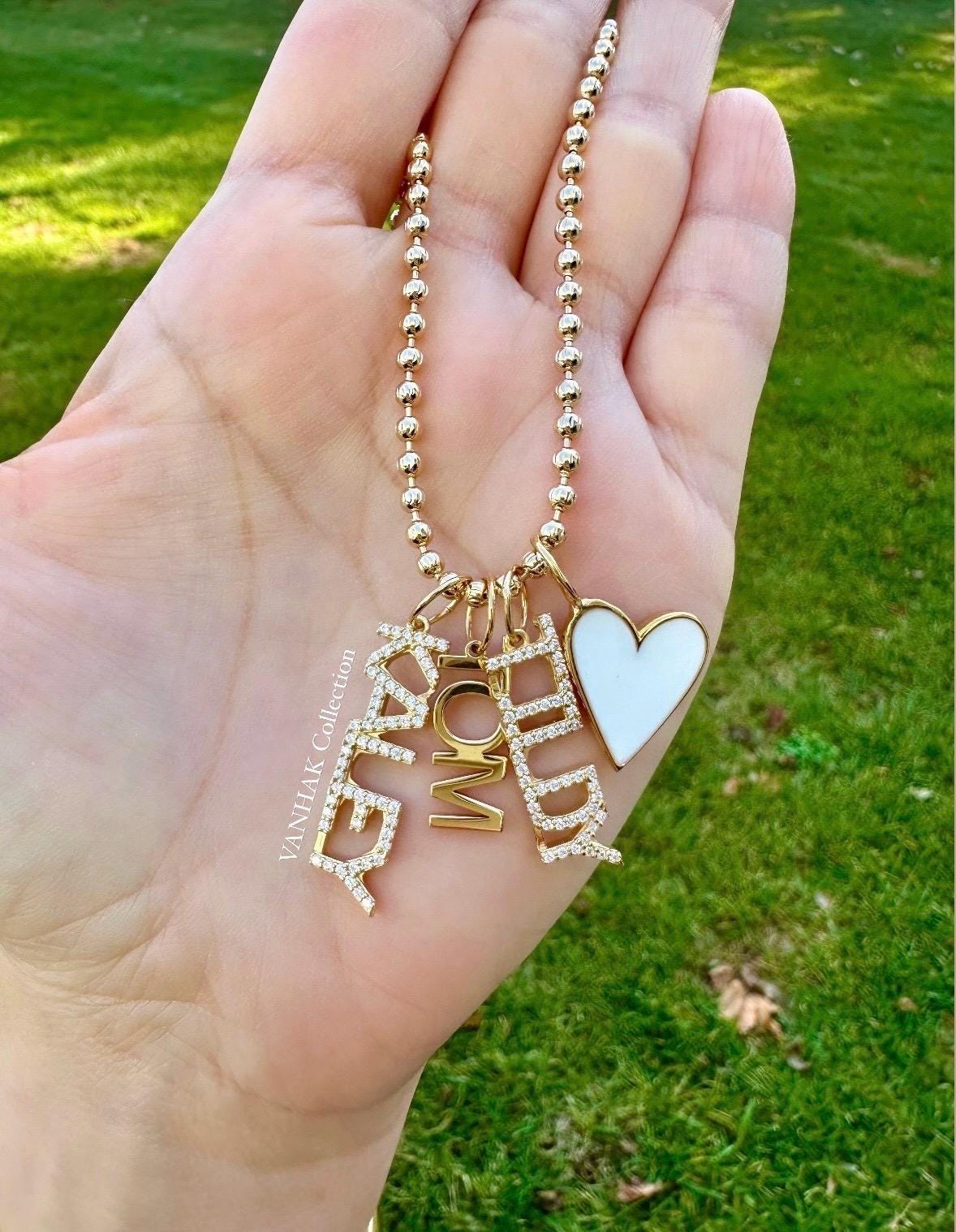 As seen on Caroline Baudino. Personalized Pave Name Charms. Diamond Charms. CZ charms. Custom name charms on Shop with Caroline.