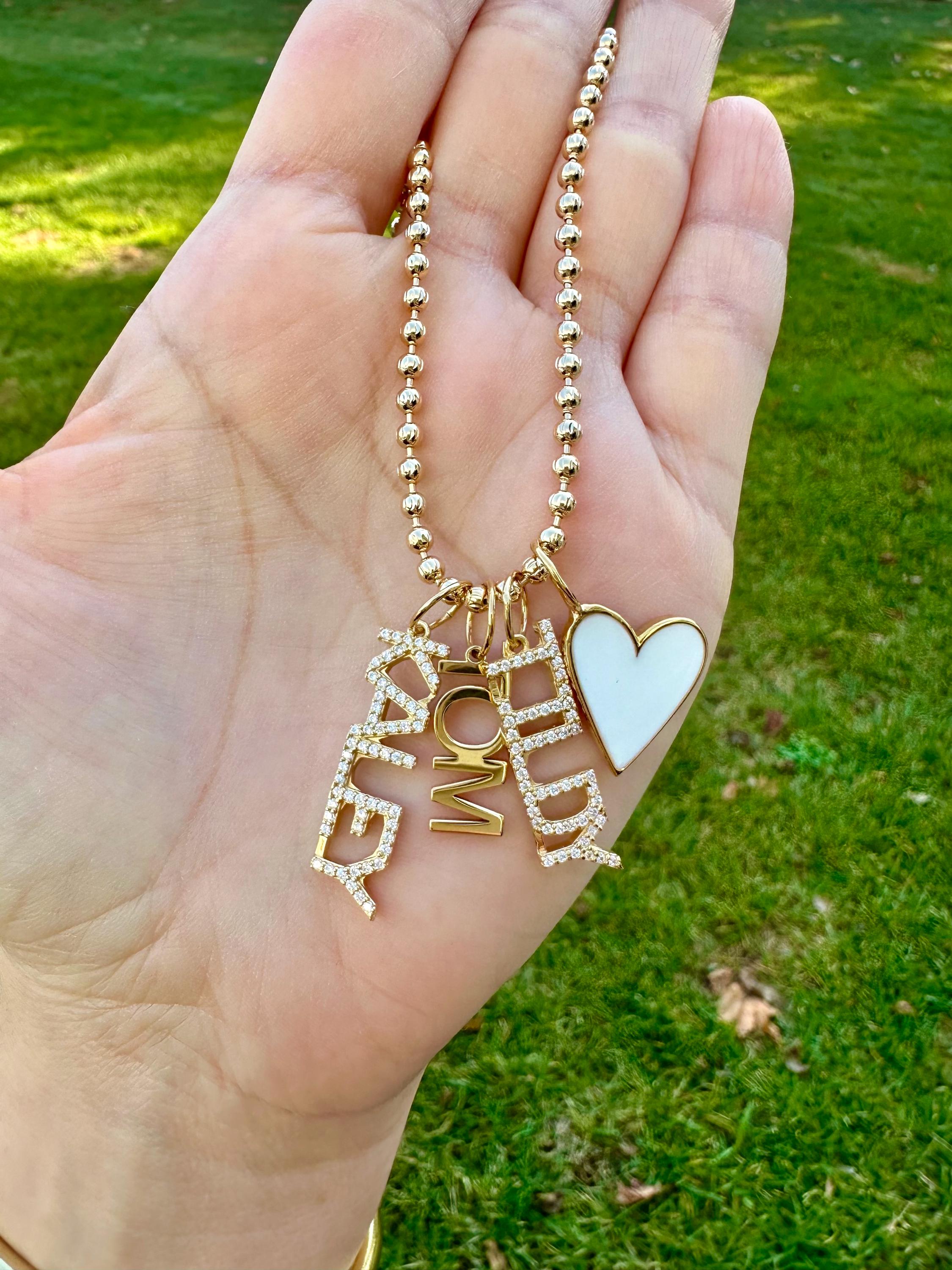 As seen on Caroline Baudino. Personalized Pave Name Charms. Diamond Charms. CZ charms. Custom name charms on Shop with Caroline.