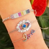 evil eye bracelets in sterling silver colors gold, rose gold and silver. Evil eye rainbow bracelet. Khamsa bracelets.