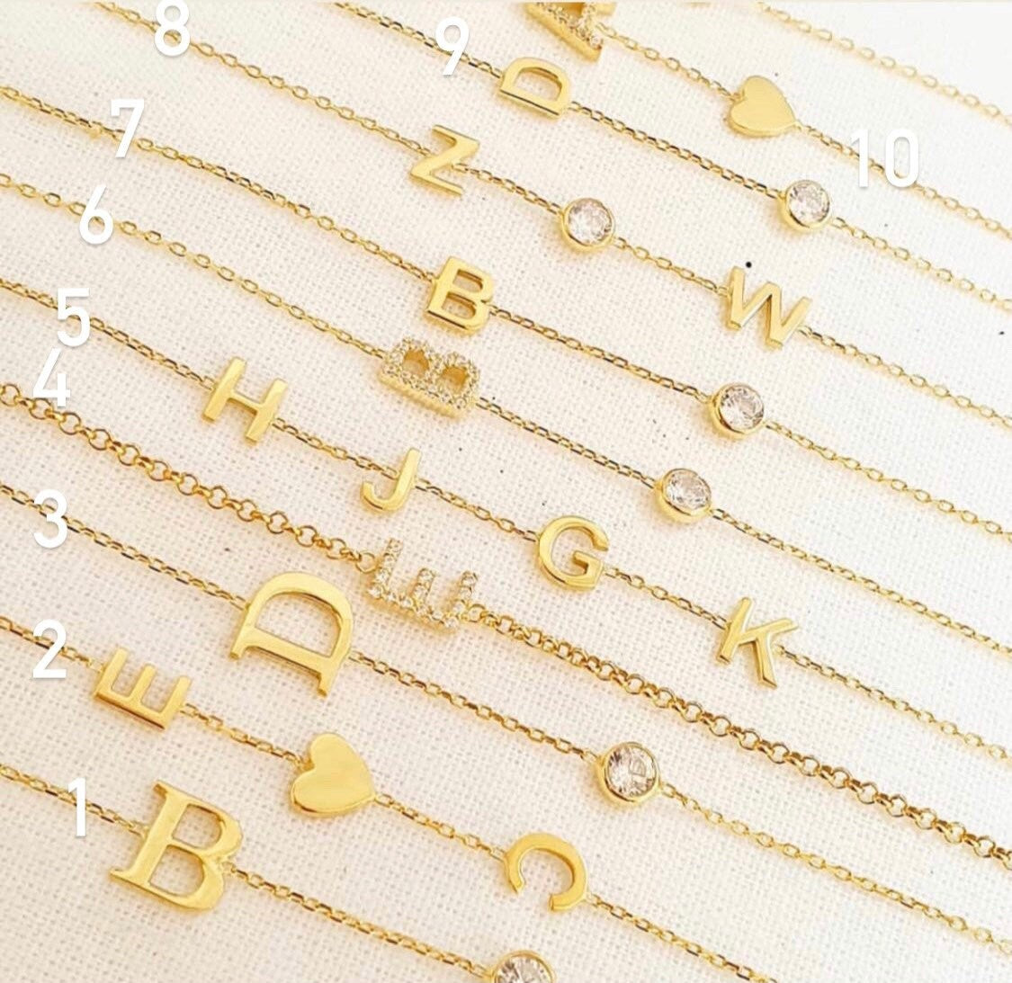 Sterling silver and gold plated CZ initial bracelets. Letter bracelets. Personalized bracelets. Mommy bracelet with heart.