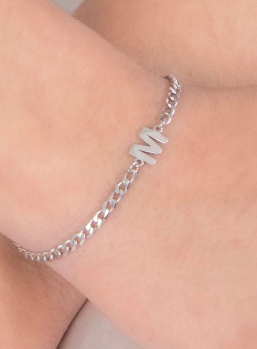 Custom initial bracelet on a cuban link chain. Personalized initialbracelet on a curb chain. Sterling silver gold plated initial bracelet.