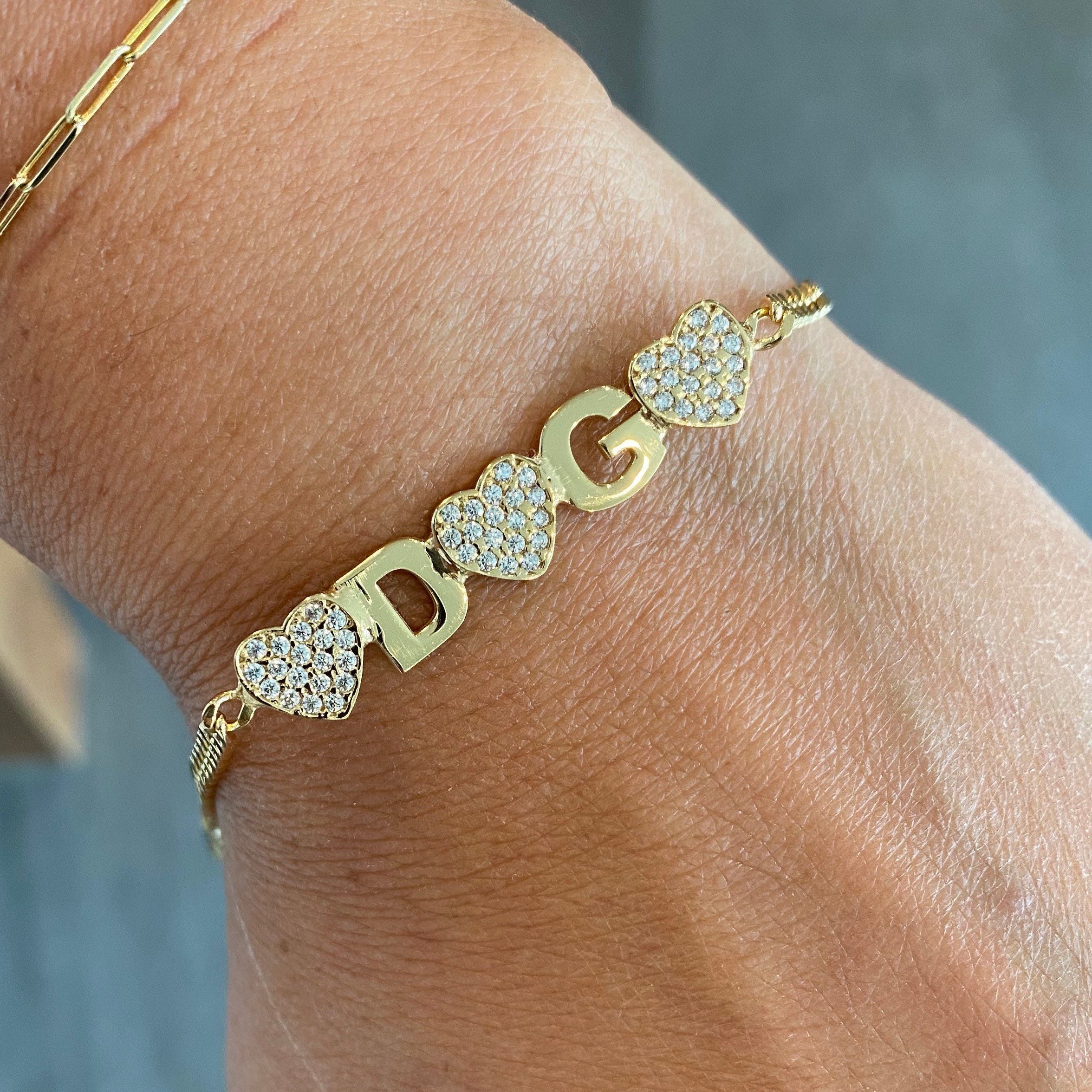 Custom Ashley name bracelet on cuban link chain. Personalized name bracelet on curb link chain. Personalized nameplate bracelet with hearts
