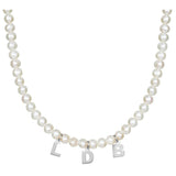 Mommy necklace with pearls and initials. Sterling silver and 14K gold plated. Available in gold or silver.