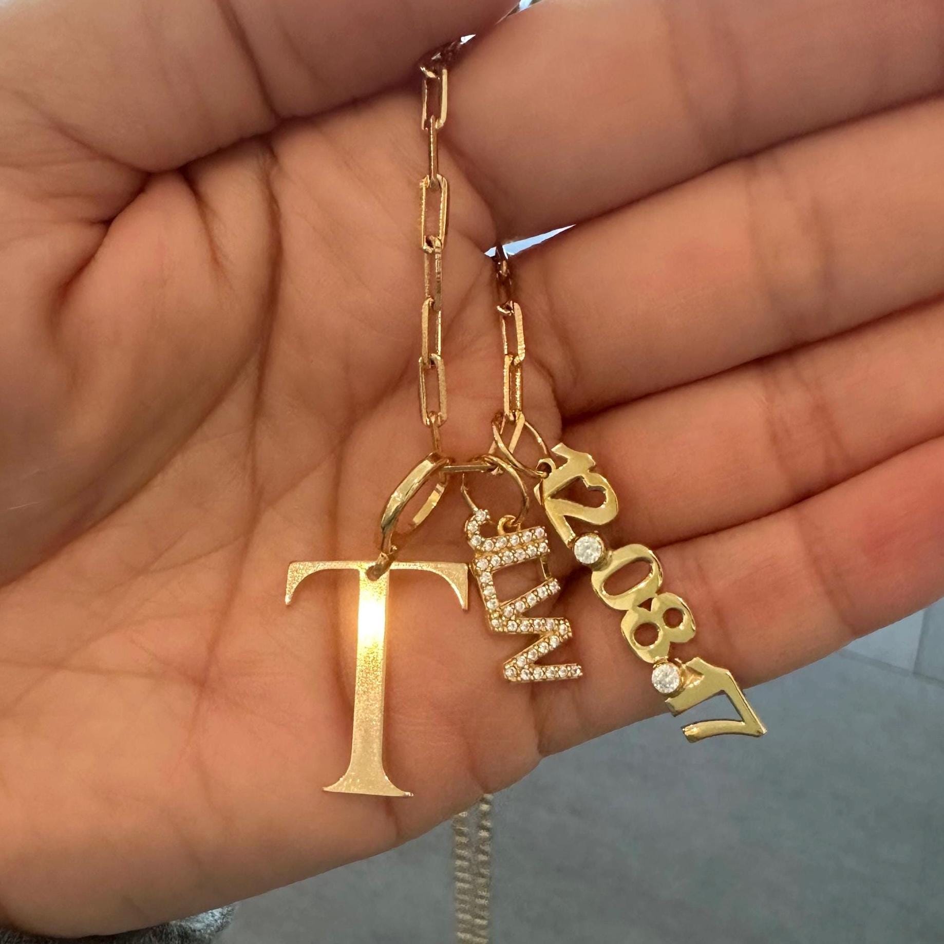 As seen on Teggy French. Personalized Pave Name Charms. Diamond Charms. Custom name charms. Jumbo Initial charm Date charm Anniversary charm